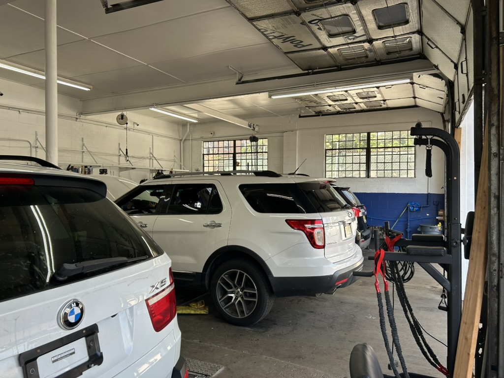 Vehicles inside the A & B Auto Repair Center workshop